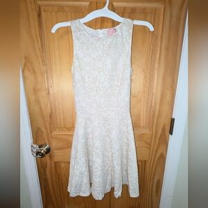 White skater dress with cute detailing.